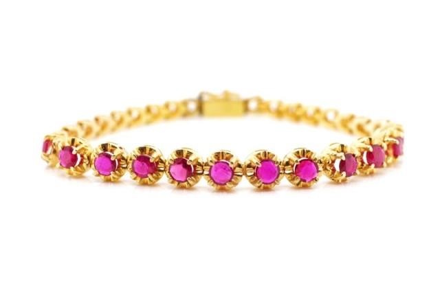 Ruby and rose gold bracelet marked 14k. Approx weight 9.7 gr...