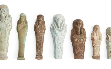 Six Egyptian glazed faience shabtis Third Intermediate-Late Period, 1070-332 B.C. Each of typical mummiform, including a miniature pale blue glazed shabti with illegible text and wig painted in added umber, 6.7cm high; five shabtis depicted holding...