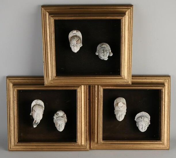 Six antique framed Chinese terracotta heads. 18th