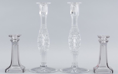 TWO PAIRS OF GLASS CANDLESTICKS 1) Cut crystal with diaper-cut stems. Unmarked. Heights 12". 2) Molded glass. Unmarked. Heights 6.25".