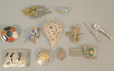 Ten silver pins, two with enamelling, one with gold