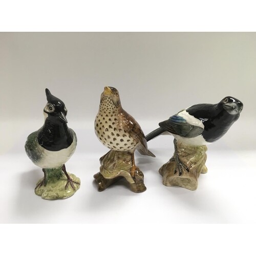 Three Beswick figures of birds comprising a Lapwing 2416, So...