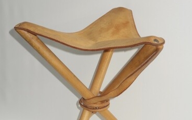 SOLD. Three legged hunting/folding stool of beech with leather seat and straps. H. 65. SH....