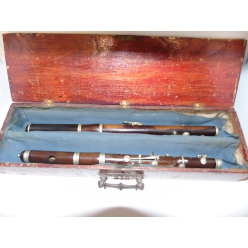 Two cased vintage marching flutes