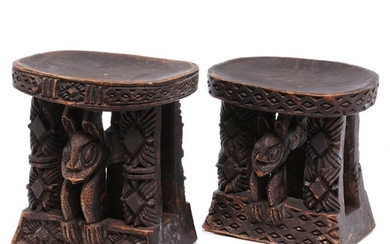 Two stools of carved patinated wood. Bamoun style. H. 30 and 33 cm. (2)