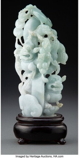 67070: A Chinese Carved Celadon Jade Shi-Shi Figural Gr