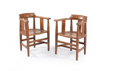 A pair of Arts and Crafts oak smokers bow armchairs