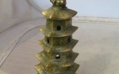 A brass model oriental temple.