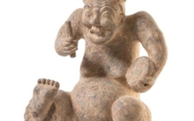 * A Chinese Red Pottery Figure of a Drummer