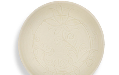 A Dingyao carved 'Day-lilies' dish