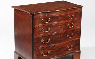 A George III serpentine fronted chest of drawers