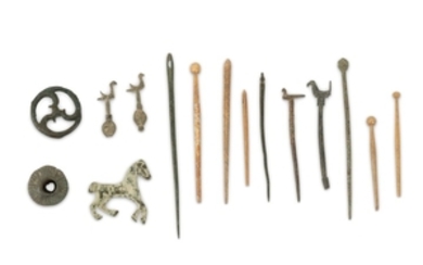 A GROUP OF ROMAN BONE AND BRONZE PIECES...
