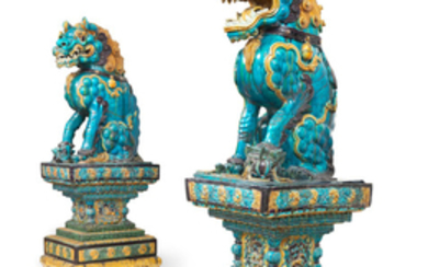 A very rare pair of monumental fahua Buddhist lions on stands