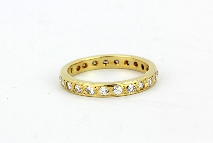A 14ct yellow gold (stamped 585) diamond set full eternity ring, (K.5).