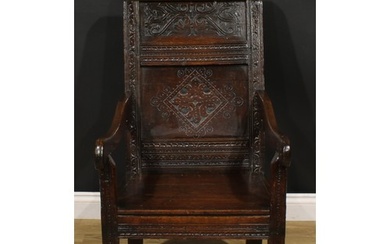 A 17th century oak wainscot armchair, rectangular panel back...