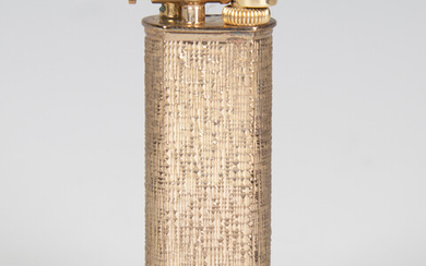 Asilver-gilt cased Dunhill lighter with engine turned decoration, boxed.