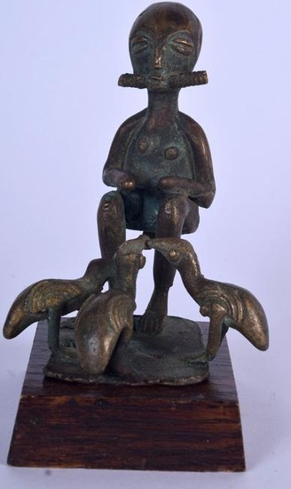 A BENIN BRONZE FIGURE OF A SEATED MALE, modelled