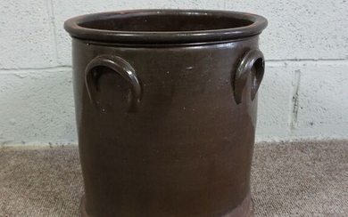 A Brown Glazed Earthenware Pot of cylindrical form with loop handles