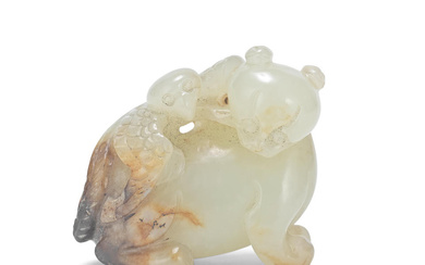 A CELADON AND RUSSET JADE 'BEAR AND EAGLE' GROUP CARVING...