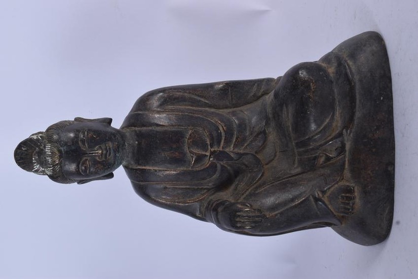 A CHINESE BRONZE STATUE OF GUANYIN. 23.5 cm high.