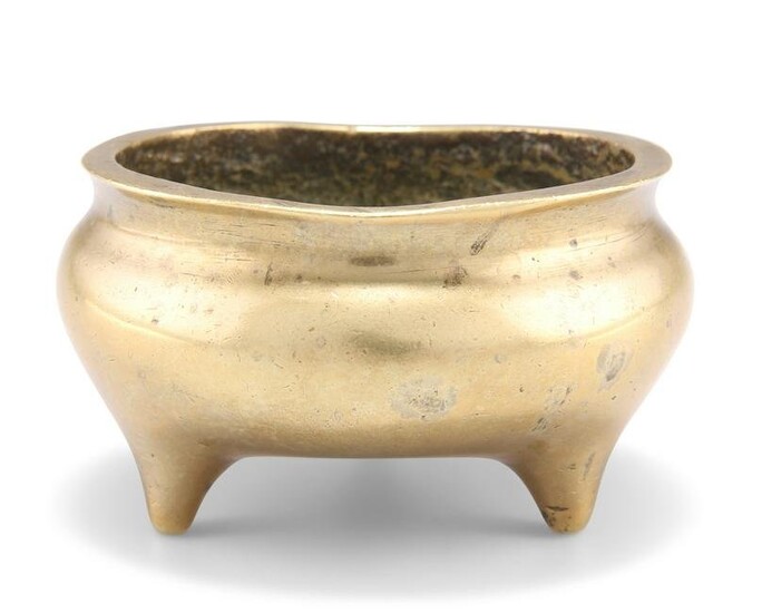 A CHINESE SMALL BRONZE TRIPOD CENSER, of squat circular