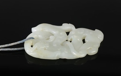 A CHINESE WHITE JADE 'DRAGON' PENDANT