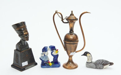 A COLLECTION OF ORNAMENTS, INCLUDING A NEFERTITI BUST, RESIN DUCK, CERAMIC FIGURAL GROUP AND A BRASS EWER