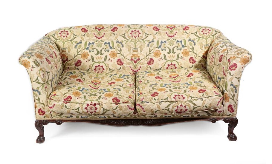 A Carved Mahogany Two-Seater Sofa, late 19th/early 20th century, recovered in modern crewelwork...