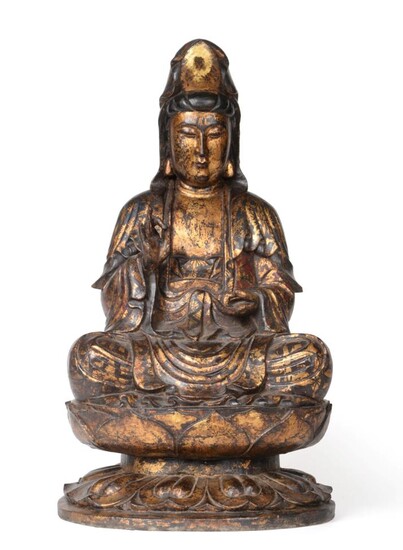 A Chinese Gilt and Lacquered Wood Figure of Buddha, probably 16th century, carved seated in...