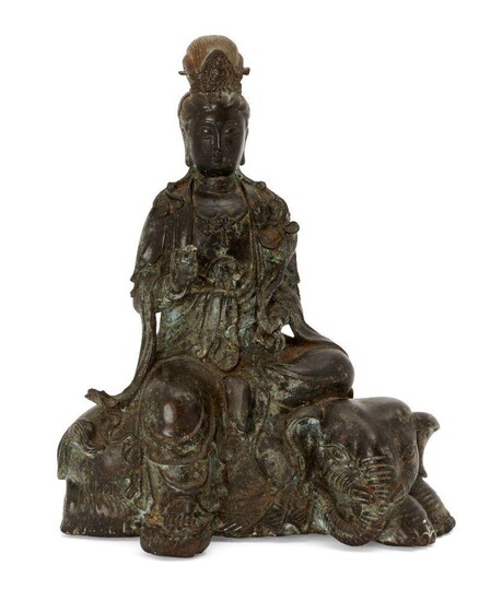 A Chinese bronze figure of Guanyin atop and elephant, late...