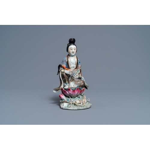 A Chinese famille rose figure of a lady on a lotus throne, 1...