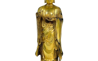 A Chinese gilt bronze model of buddha, 19th century.