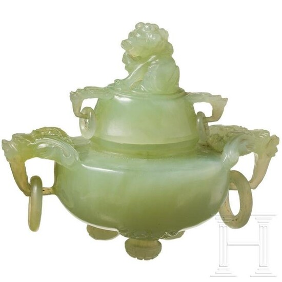 A Chinese lidded vessel in light green jade, late