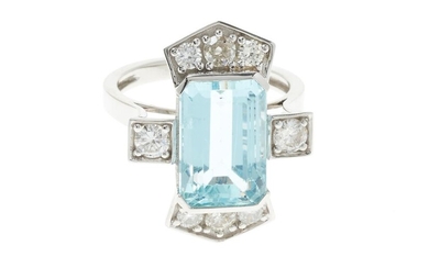 A DECO STYLE PLATINUM AQUAMARINE AND DIAMOND RING; centring an approx. 6.80ct emerald cut aquamarine set at each end and on the upsw...