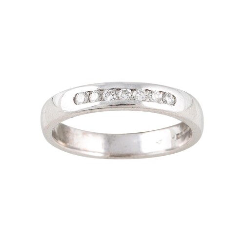 A DIAMOND HALF ETERNITY RING, channel set, mounted in yellow...