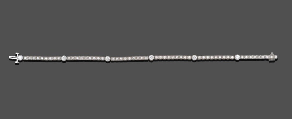 A Diamond Line Bracelet, bar links set with nine old cut diamonds in white square claw and...