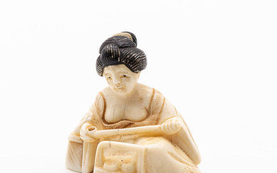 A Fine Japanese Carved Ivory Netsuke of a Geisha with an Opium Pipe, 19th Century