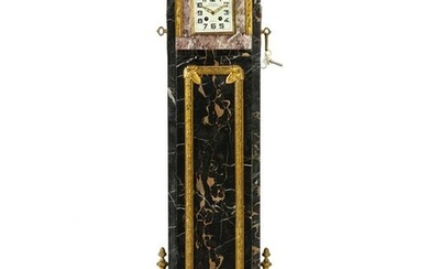 A French Art Deco marble and gilt bronze-mounted clock