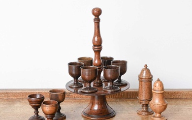 A Fruitwood Treen Egg Stand and Six Cups, early 19th...
