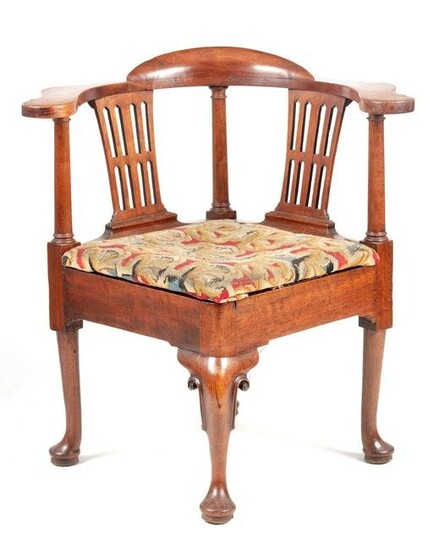 A GEORGE II MAHOGANY CORNER CHAIR with shaped armrests