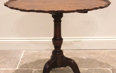 A George III mahogany tilt top tripod table, the circular to...