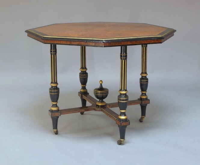 A George III style mahogany drop leaf dining table and four chairs, early 20th century, the rounded rectangular boxwood strung top raised on square tapering supports to brass caps and casters, 153x92x74cm (5)