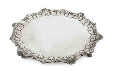 A George V silver salver, with shaped scroll and scalloped...