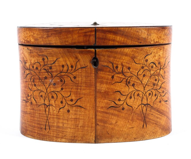 A Georgian satinwood tea caddy of oval form, the lid adorned with an inlaid fan motif