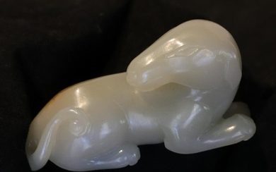 A HETIAN JADE ORNAMENT CARVED IN DOG SHAPE
