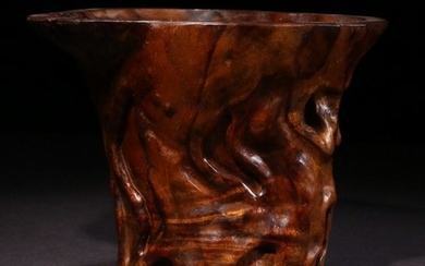 A HUANGHUALI WOOD CARVED FLOWER PATTERN CUP