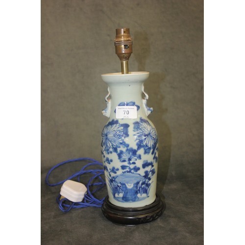 A Korean style pottery vase, decorated in blue on hardwood s...