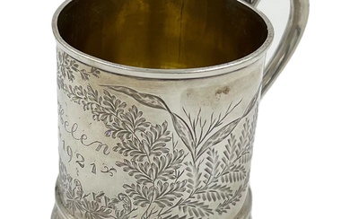 A LATE VICTORIAN SILVER CHRISTENING MUG WITH FOLIATE DETAIL...