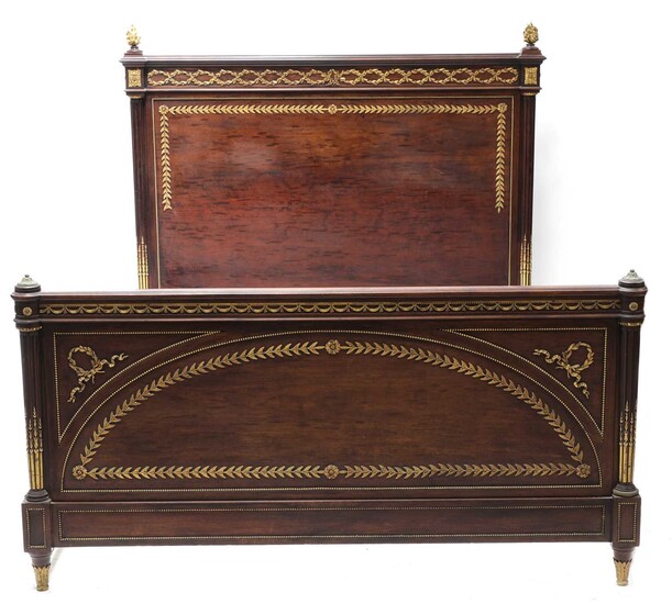 A Louis XVI-style plum pudding mahogany double bed