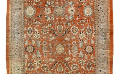 A Mahal carpet, North West Persia. A decorative room size all over design of large palmette and entwined branches, flowers. Early 20th century. 630×403 cm.